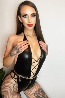 Female Stripper Package for Bucks Nights sexy female stripper with smouldering looks kneeling in bra and panties